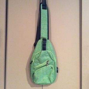 Green Sling Bag With Charging Portal.